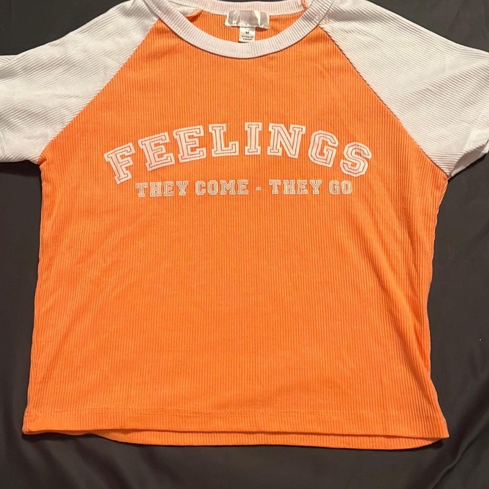 Yellow and white crop top saying feeling they come they go ,medium